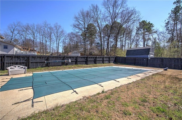 view of swimming pool featuring a fenced in pool and a fenced backyard