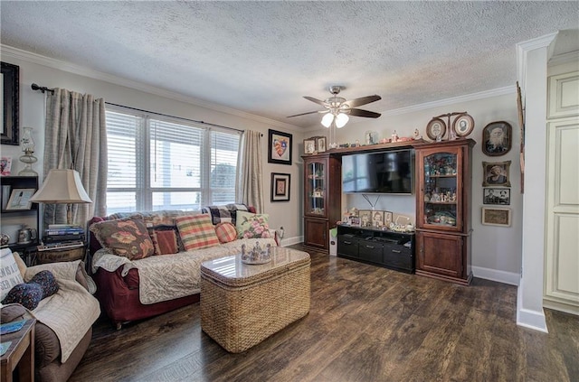 living room with a textured ceiling, crown molding, baseboards, ceiling fan, and dark wood-style flooring