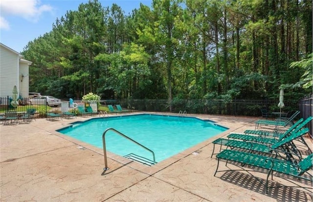 212 Riverstone Commons Cir, Canton, GA 30114 - community pool with a patio