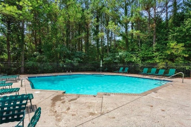 212 Riverstone Commons Cir, Canton, GA 30114 - community pool with a patio area