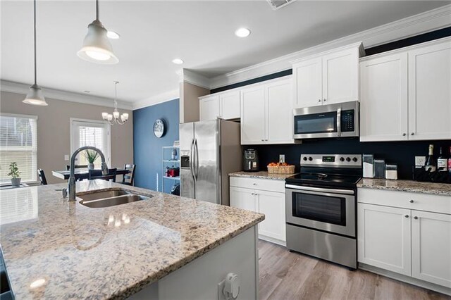 438 Crescent Woode Dr, Dallas, GA 30157 - kitchen with white cabinets, stainless steel appliances, a sink, crown molding, and a notable chandelier