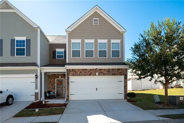 438 Crescent Woode Dr, Dallas, GA 30157 - townhome / multi-family property featuring a front lawn, brick siding, driveway, and a garage