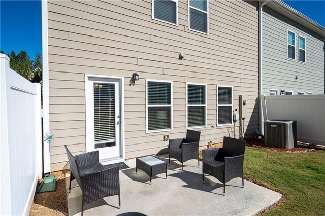 438 Crescent Woode Dr, Dallas, GA 30157 - back of property featuring a patio, a fenced backyard, a yard, and central AC unit