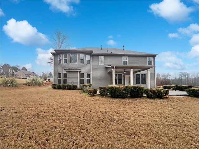 back of house with a yard