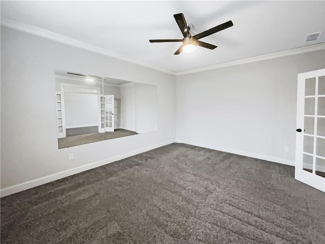 carpeted empty room featuring ornamental molding, ceiling fan, and french doors