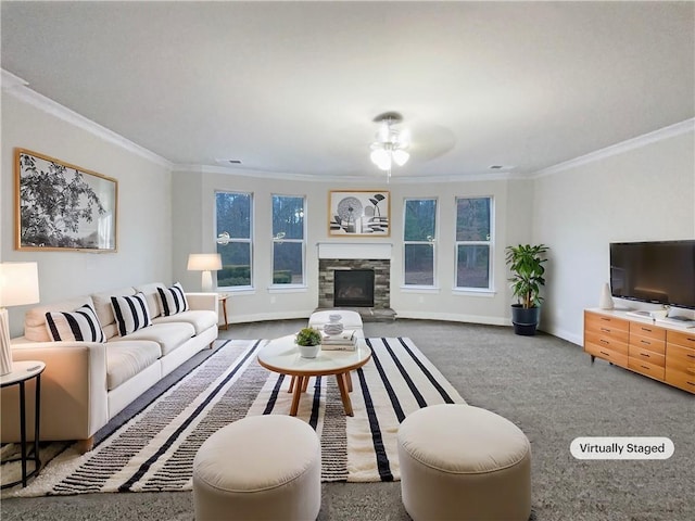 carpeted living room featuring crown molding and a stone fireplace