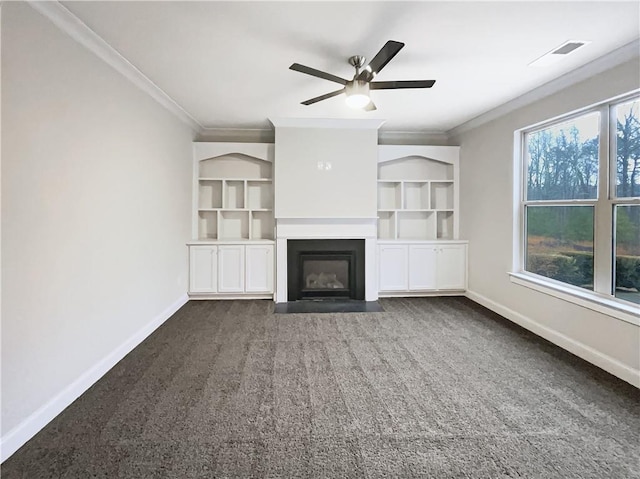 unfurnished living room featuring dark carpet, crown molding, and ceiling fan