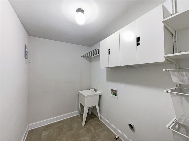 laundry area with cabinets and hookup for a washing machine