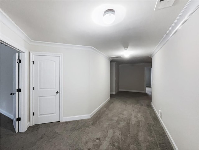 corridor with crown molding and dark colored carpet