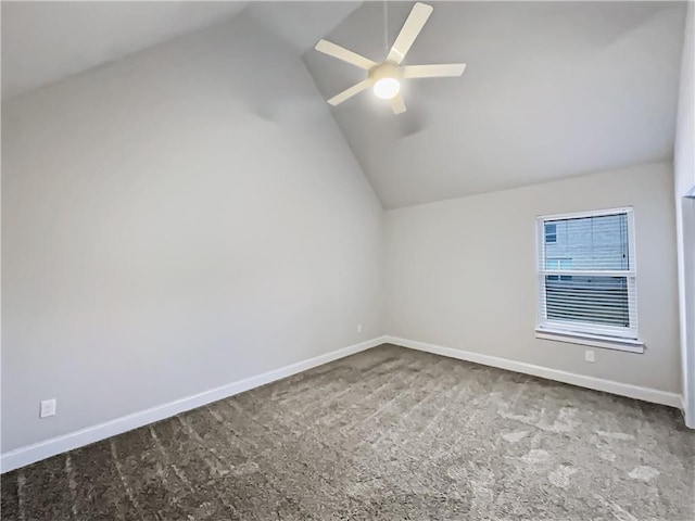 carpeted empty room featuring lofted ceiling and ceiling fan