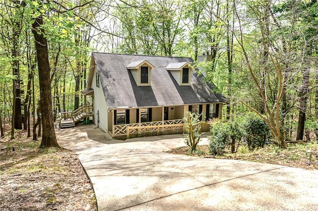 cape cod home with a porch