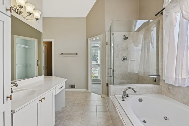 bathroom featuring vanity, tile patterned flooring, and independent shower and bath