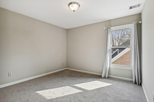 empty room featuring light carpet