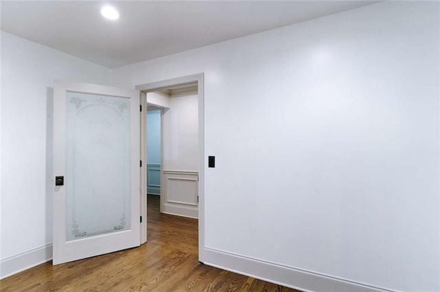 unfurnished bedroom featuring wood finished floors and recessed lighting