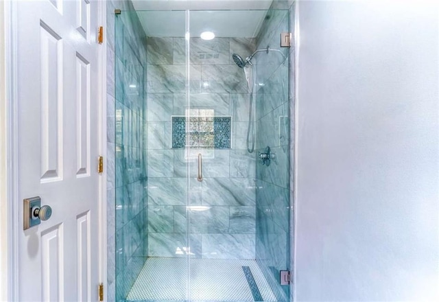 bathroom with a shower stall
