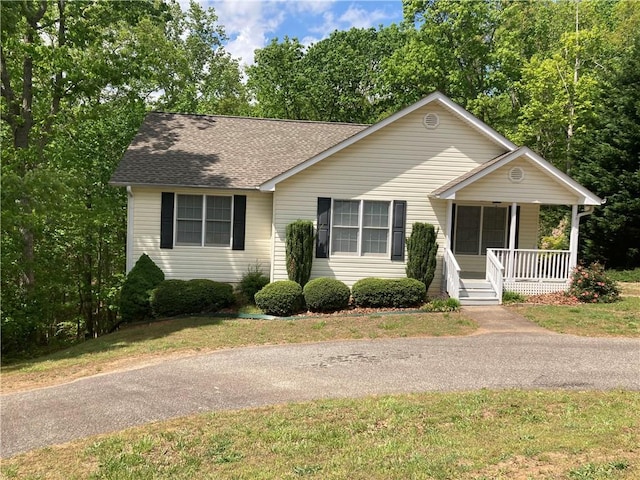 142 Cedar Springs Ln, Dahlonega, GA 30533 - view of front of property with a front lawn, roof with shingles, and a porch