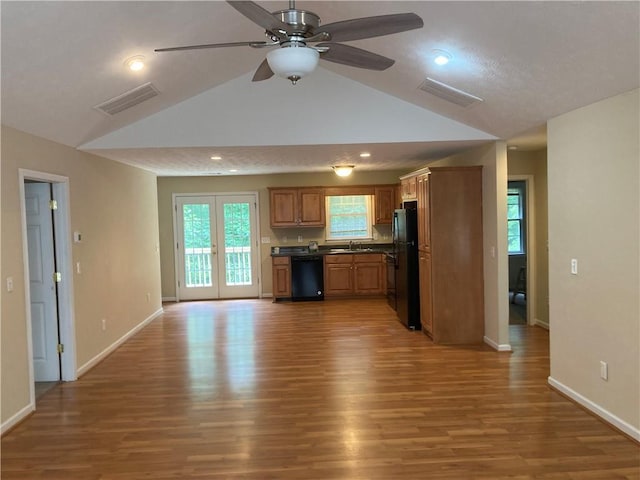 142 Cedar Springs Ln, Dahlonega, GA 30533 - kitchen with black appliances, a sink, lofted ceiling, dark countertops, and wood finished floors