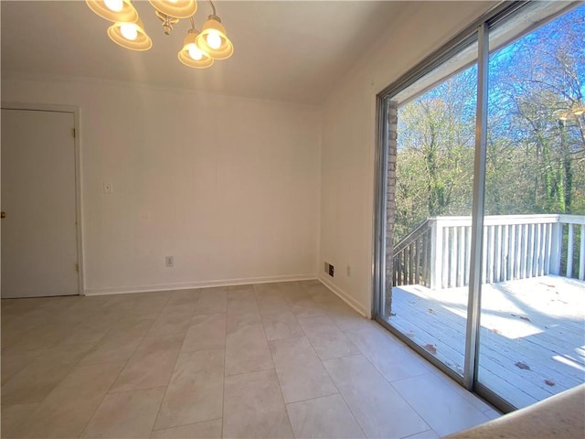 spare room with light tile patterned flooring and a notable chandelier