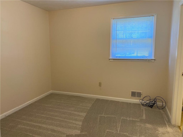 unfurnished room featuring carpet flooring