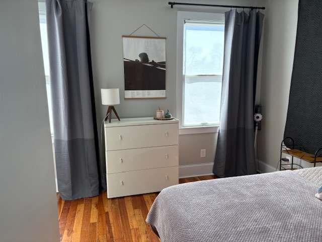 23 Poplar St, Porterdale, GA 30014 - bedroom with light wood finished floors and baseboards