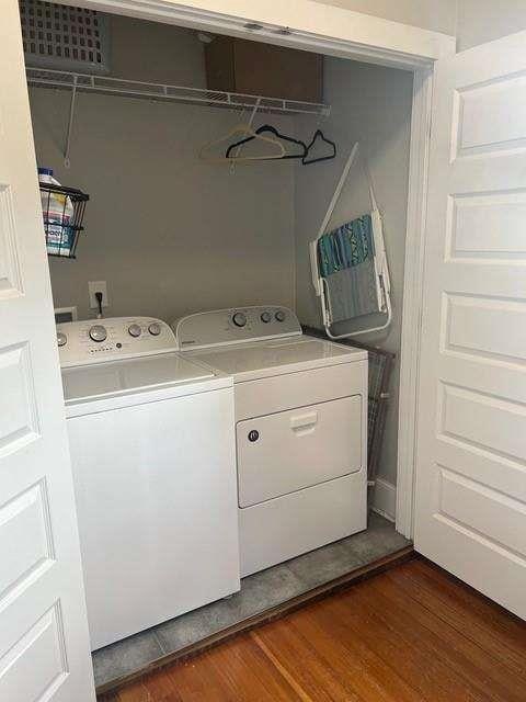 23 Poplar St, Porterdale, GA 30014 - laundry room with washing machine and dryer, dark wood finished floors, and laundry area