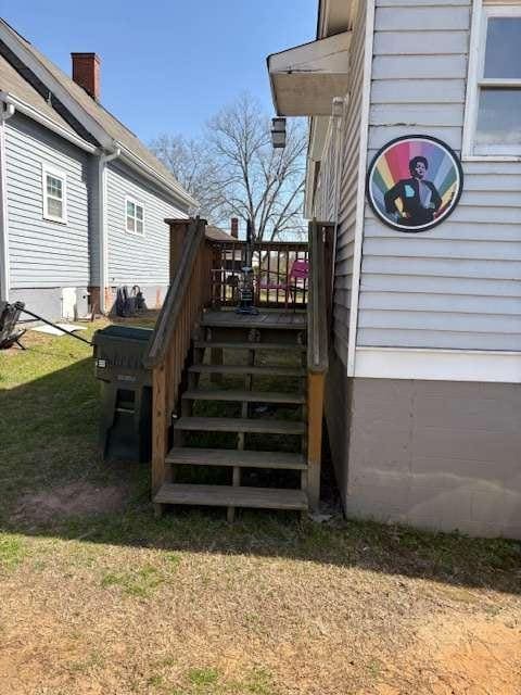 23 Poplar St, Porterdale, GA 30014 - exterior space with stairway and a yard