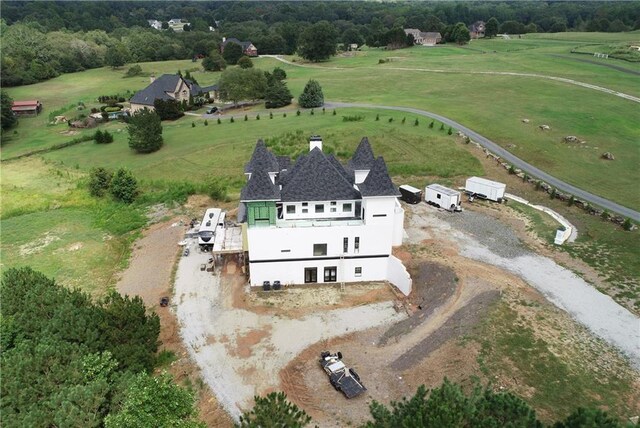 birds eye view of property featuring a rural view