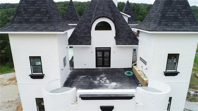 back of property featuring french doors