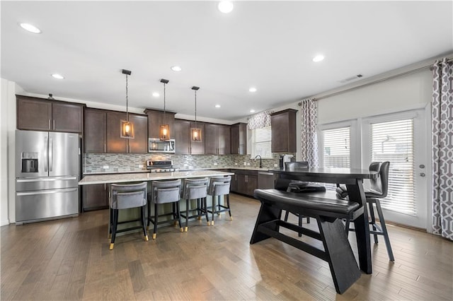 dining space featuring dark hardwood / wood-style floors and sink