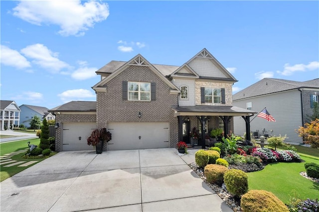 craftsman house featuring a front lawn and a garage