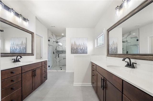 bathroom featuring walk in shower, vanity, and tile patterned flooring