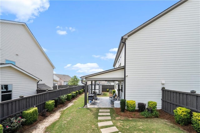 exterior space featuring a yard and a patio area