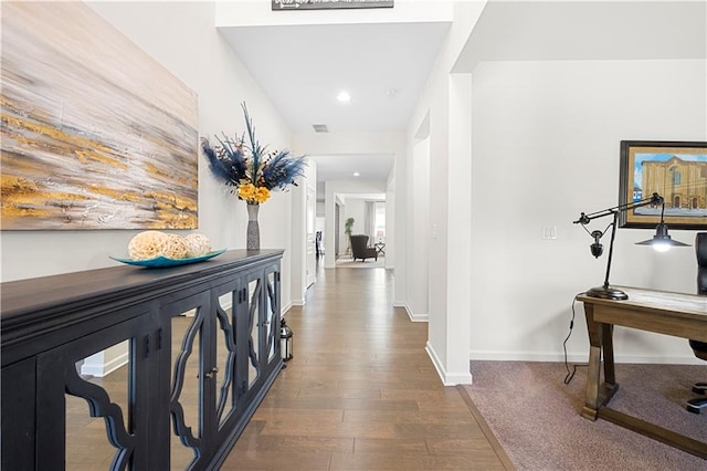 hall featuring dark wood-type flooring