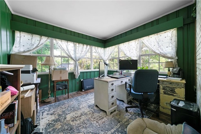 office area with ornamental molding and wood finished floors