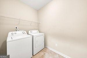 washroom with washer and clothes dryer