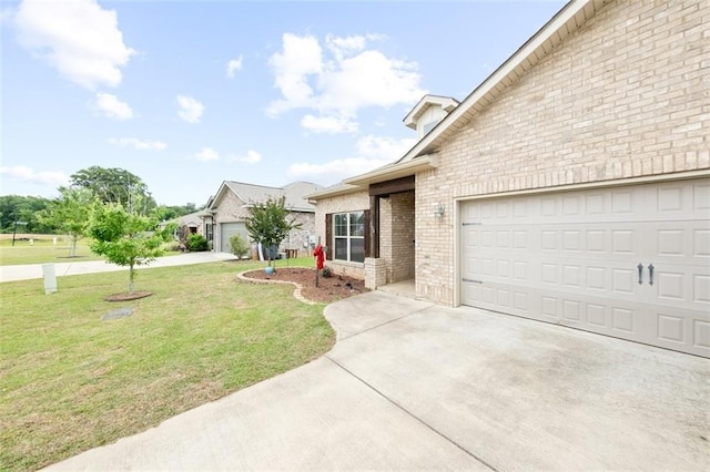 view of front facade with a front yard and a garage