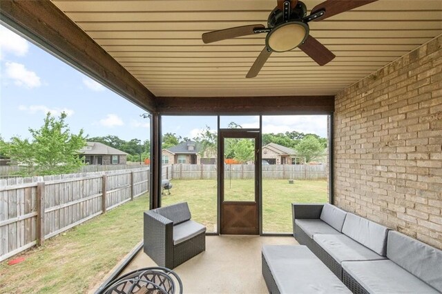 sunroom / solarium with wooden ceiling and ceiling fan