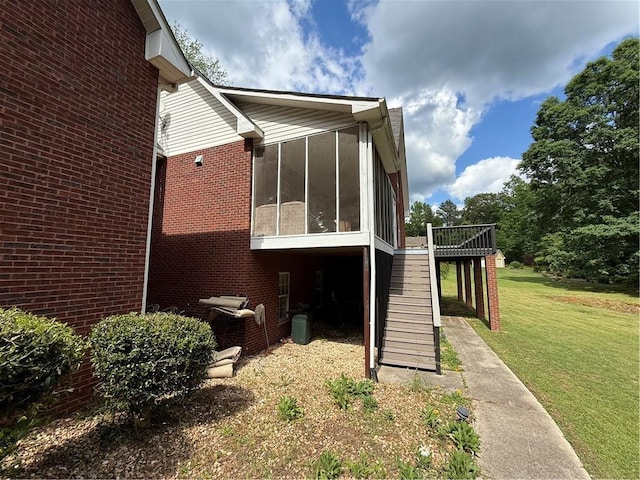 349 Bald Rock Rd, Oxford, GA 30054 - back of property featuring stairs, a sunroom, a lawn, brick siding, and a deck