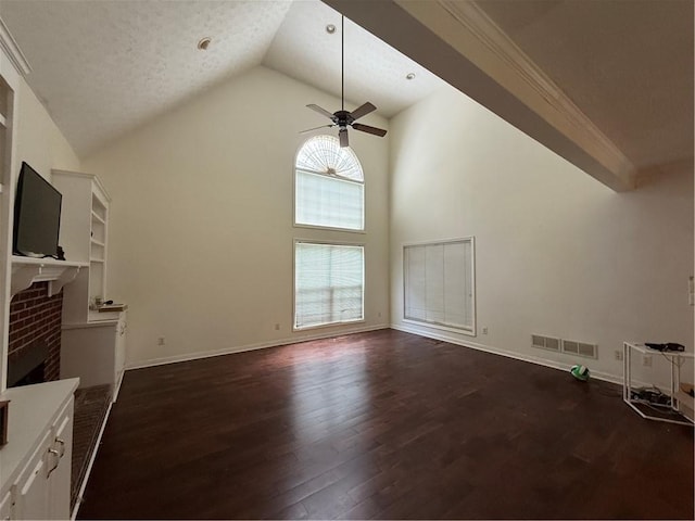 349 Bald Rock Rd, Oxford, GA 30054 - unfurnished living room with high vaulted ceiling, dark wood finished floors, a brick fireplace, ceiling fan, and baseboards