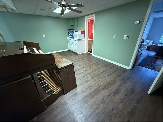 349 Bald Rock Rd, Oxford, GA 30054 - kitchen with a ceiling fan, a paneled ceiling, dark wood-type flooring, a desk, and baseboards
