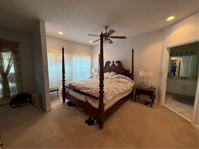 349 Bald Rock Rd, Oxford, GA 30054 - bedroom with light colored carpet, recessed lighting, ensuite bathroom, a ceiling fan, and baseboards