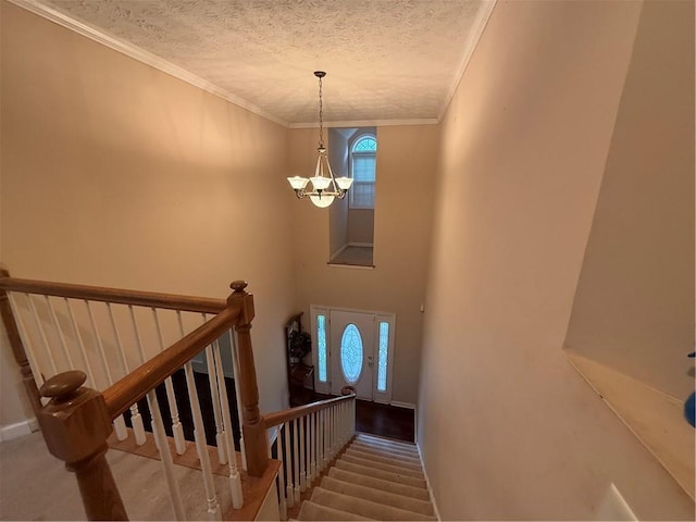 349 Bald Rock Rd, Oxford, GA 30054 - stairway featuring a chandelier, a textured ceiling, crown molding, and baseboards