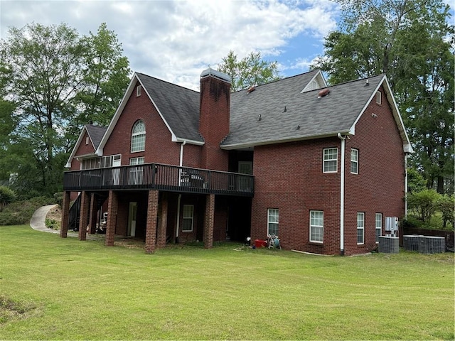 349 Bald Rock Rd, Oxford, GA 30054 - back of property with a lawn, a deck, brick siding, a chimney, and a shingled roof
