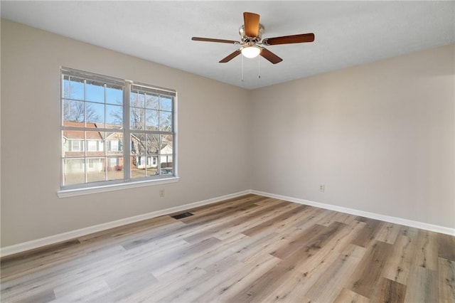 unfurnished room with ceiling fan and light hardwood / wood-style flooring