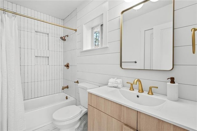 full bathroom with vanity, shower / tub combo, and toilet