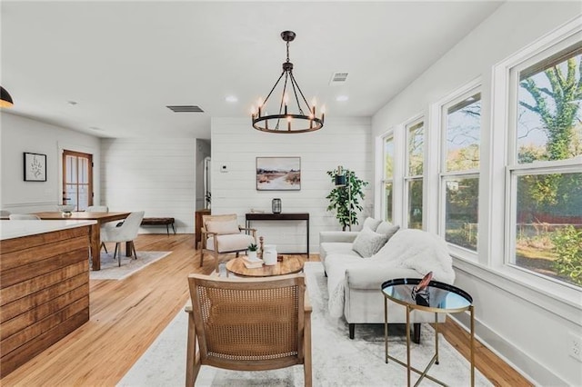 interior space with a healthy amount of sunlight and a notable chandelier