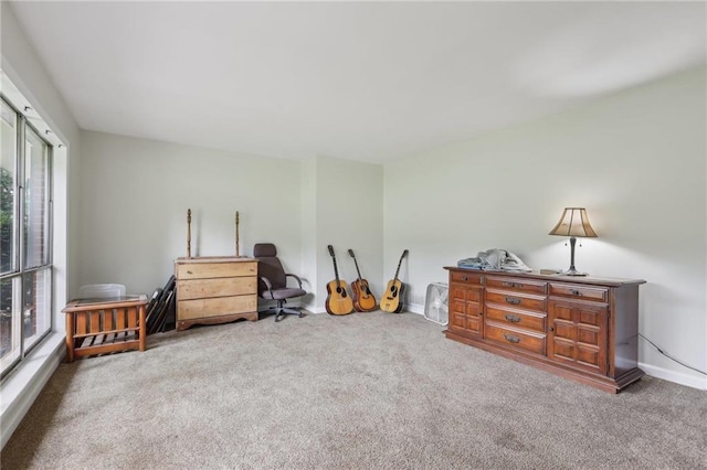 bedroom featuring carpet flooring and baseboards