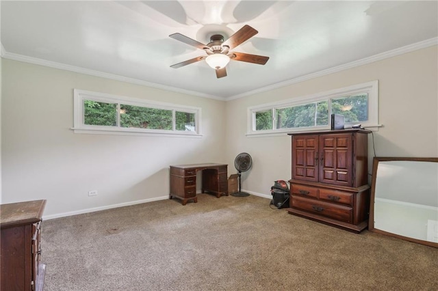 carpeted bedroom with crown molding, a ceiling fan, and baseboards