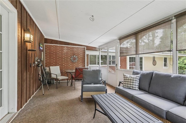 sunroom featuring an outdoor living space