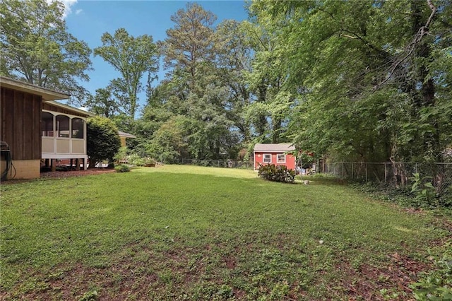 view of yard featuring a sunroom